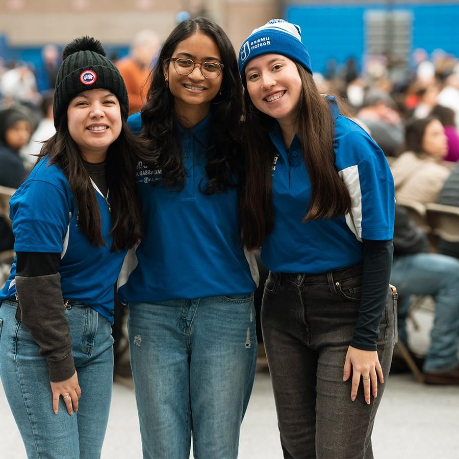 Welcome Day 3 student workers smiling in gym.